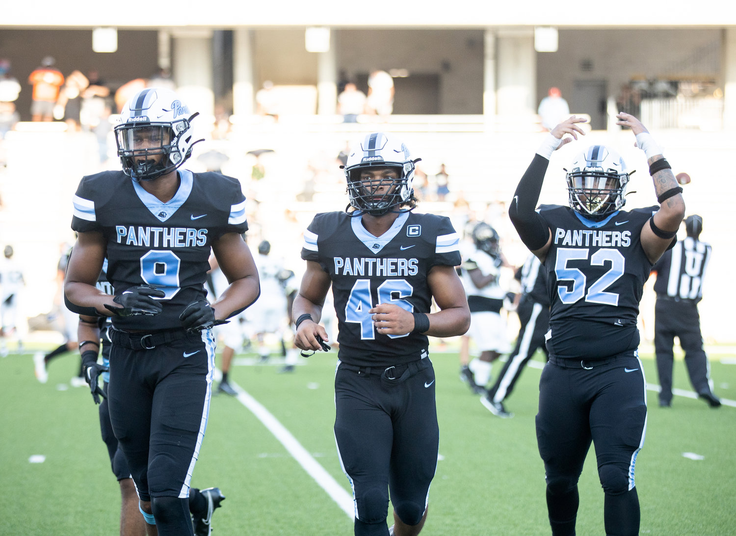 Paetow players celebrate as they come off the field after forcing a turnover during Friday’s game against Conroe at Legacy Stadium.